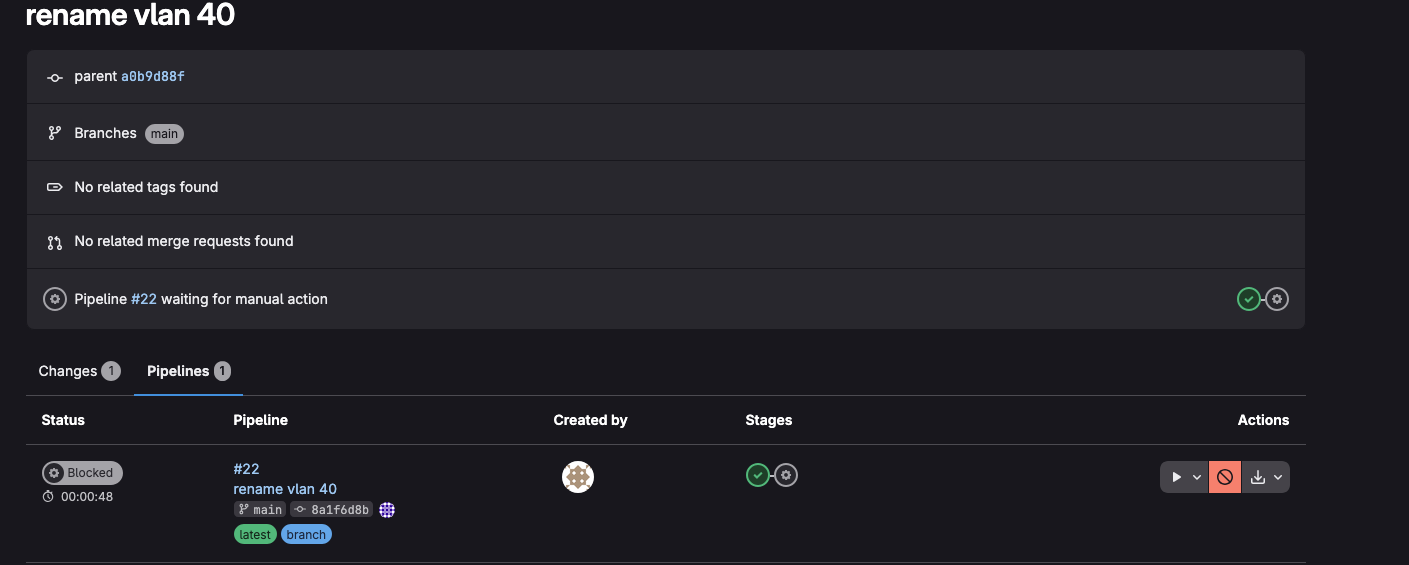 GitLab commit showing the pipeline waiting on the manual deploy gate
